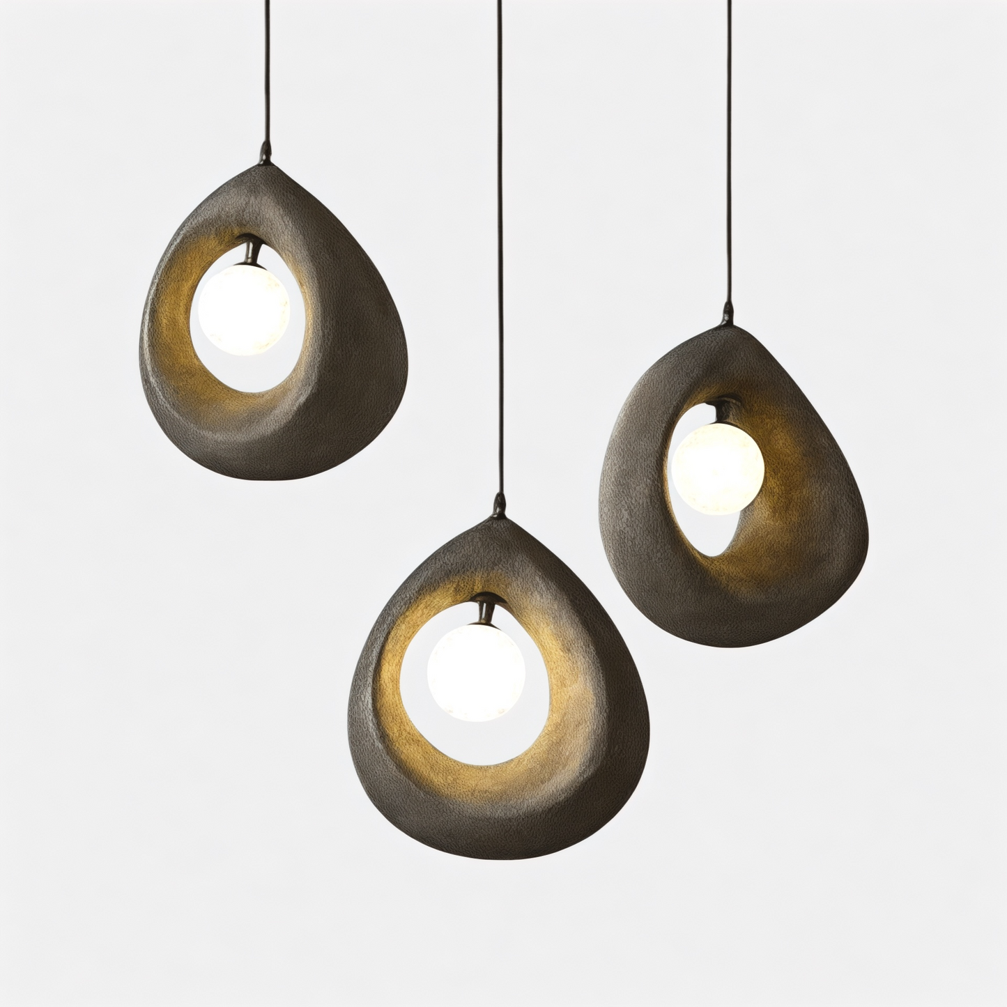 Art deco pendant light with three Nordic wabi-sabi LED hanging lamps in organic teardrop shapes, ideal for dining room ambiance and modern decor.