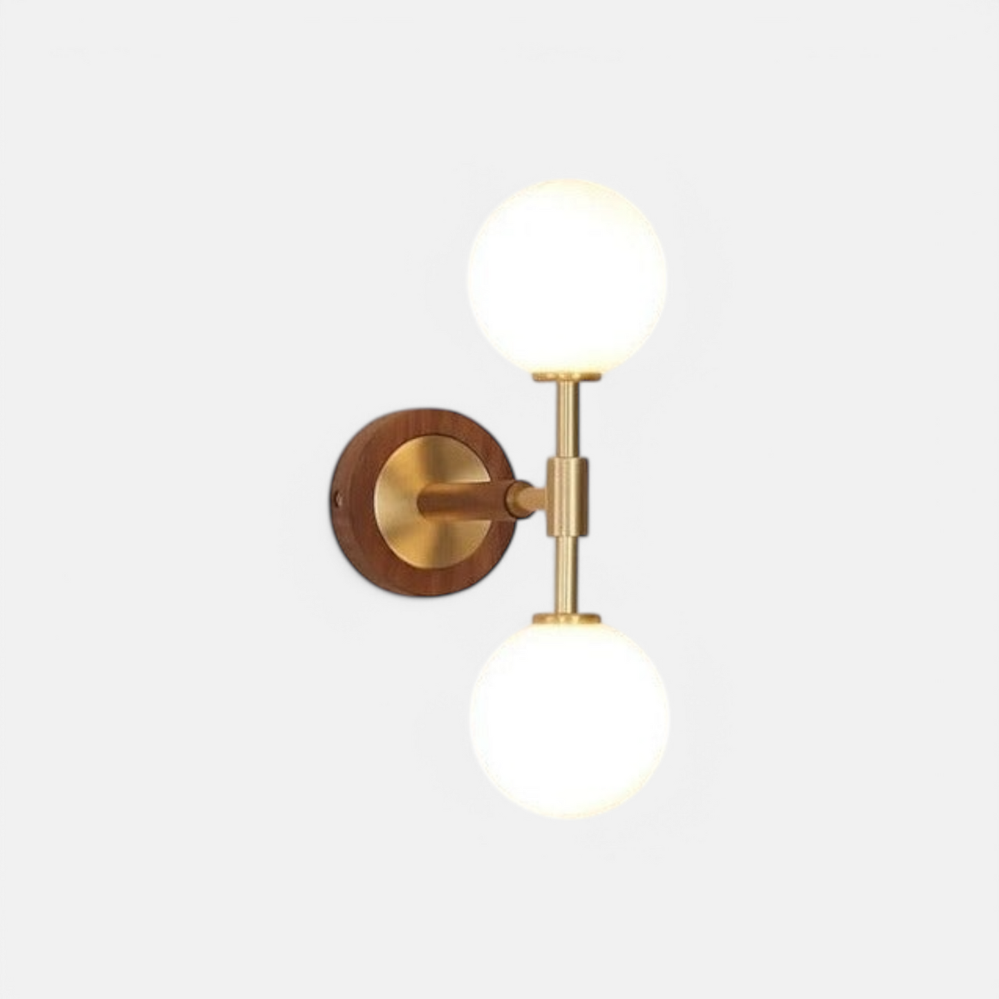 LUXELY brass wall sconce with modern copper finish and dual frosted glass globes, ideal for bedroom or hallway lighting.