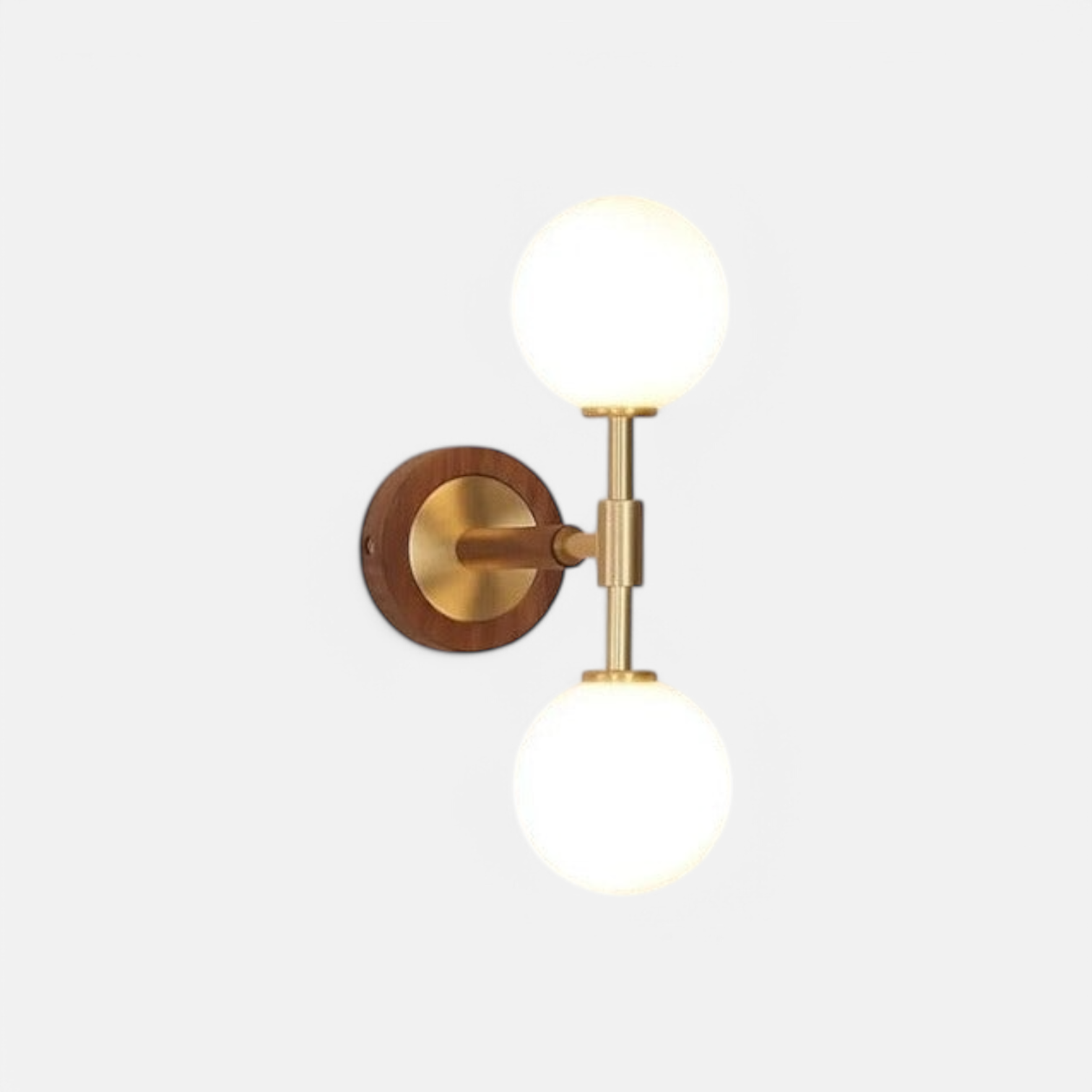 LUXELY brass wall sconce with modern copper finish and dual frosted glass globes, ideal for bedroom or hallway lighting.