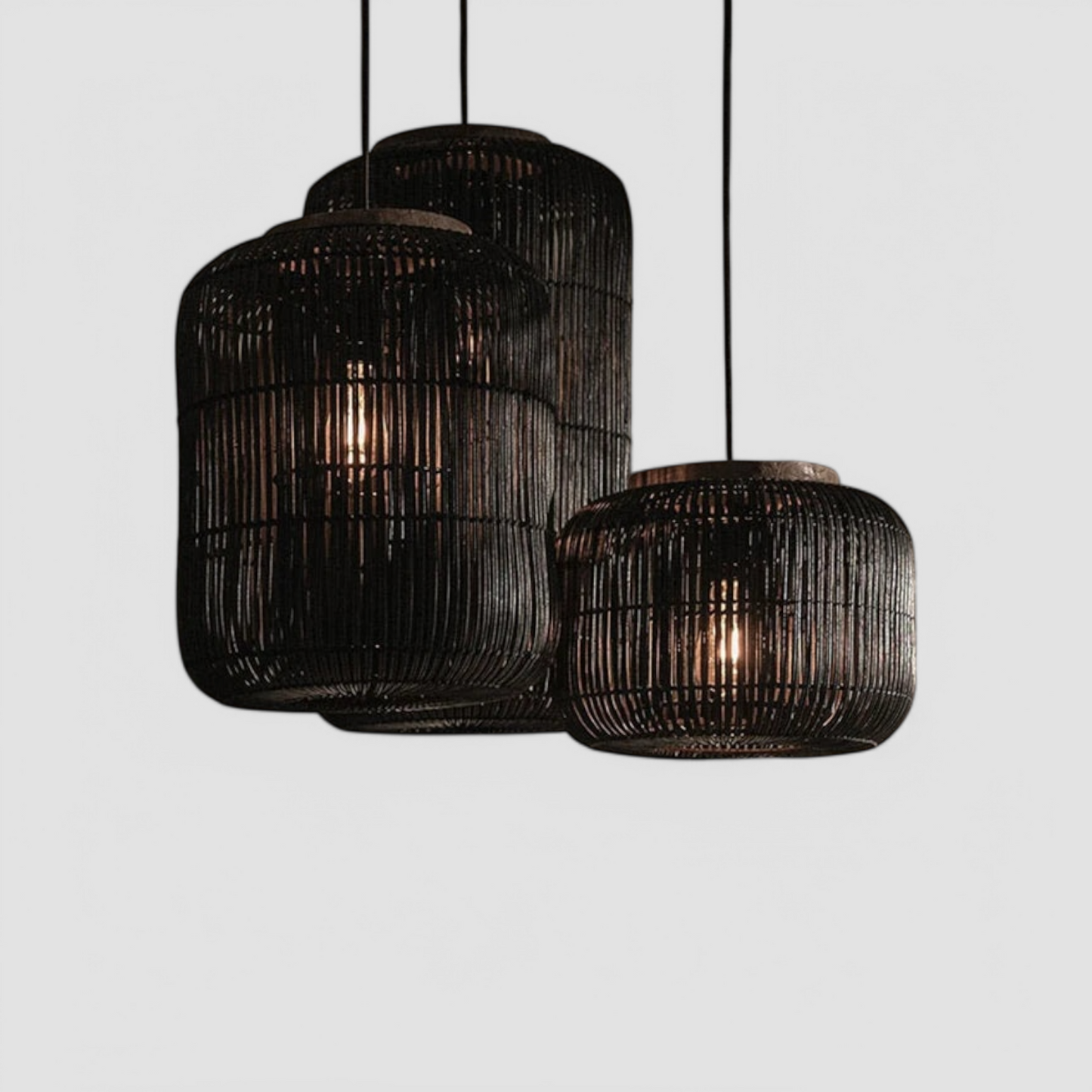 Set of three black LUXELY retro rattan pendant lights in wabi-sabi japandi style, ideal for modern minimalist ceiling lighting.
