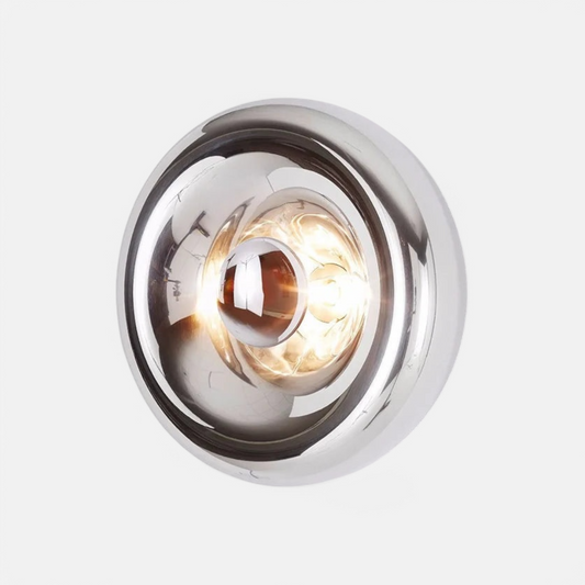 Art deco lava wall lamp in silver with round glass design, ideal for modern bedroom or hallway lighting decor.