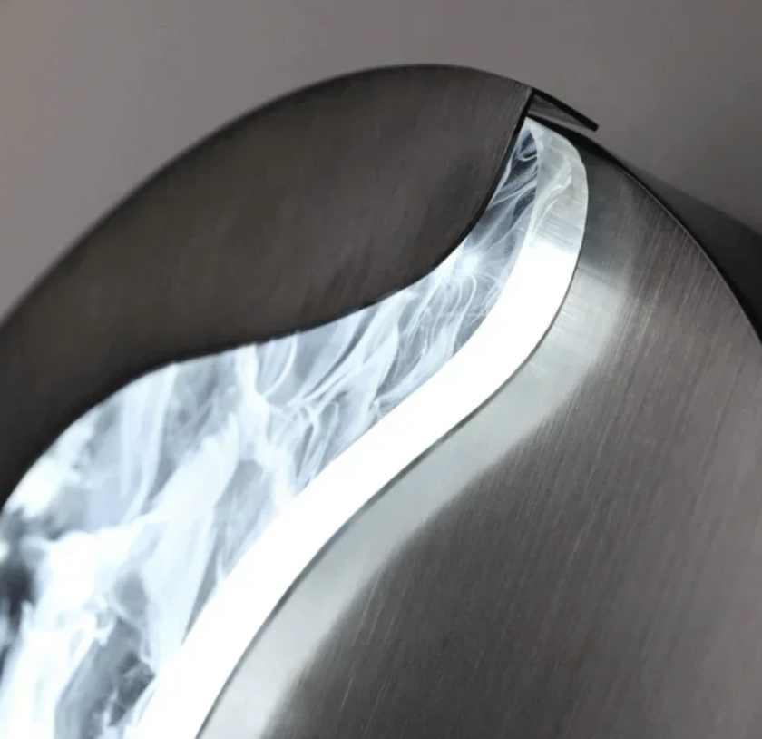 Abstract face wall sconce