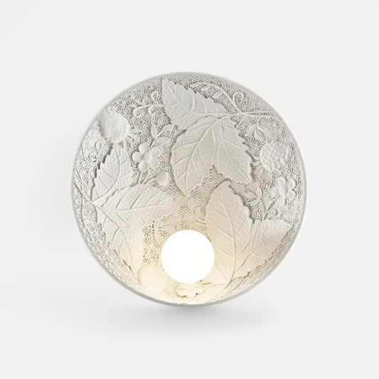 Vintage imperial wall lamp with embossed floral and leaf design, round art deco sconce ideal for elegant bedroom or hallway lighting.