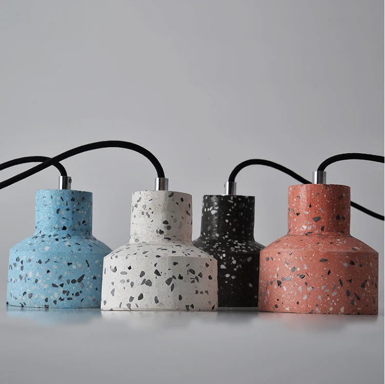 Four LUXELY terrazzo pendant lamps in blue, white, black, and red cement finishes, displayed horizontally for product showcase.