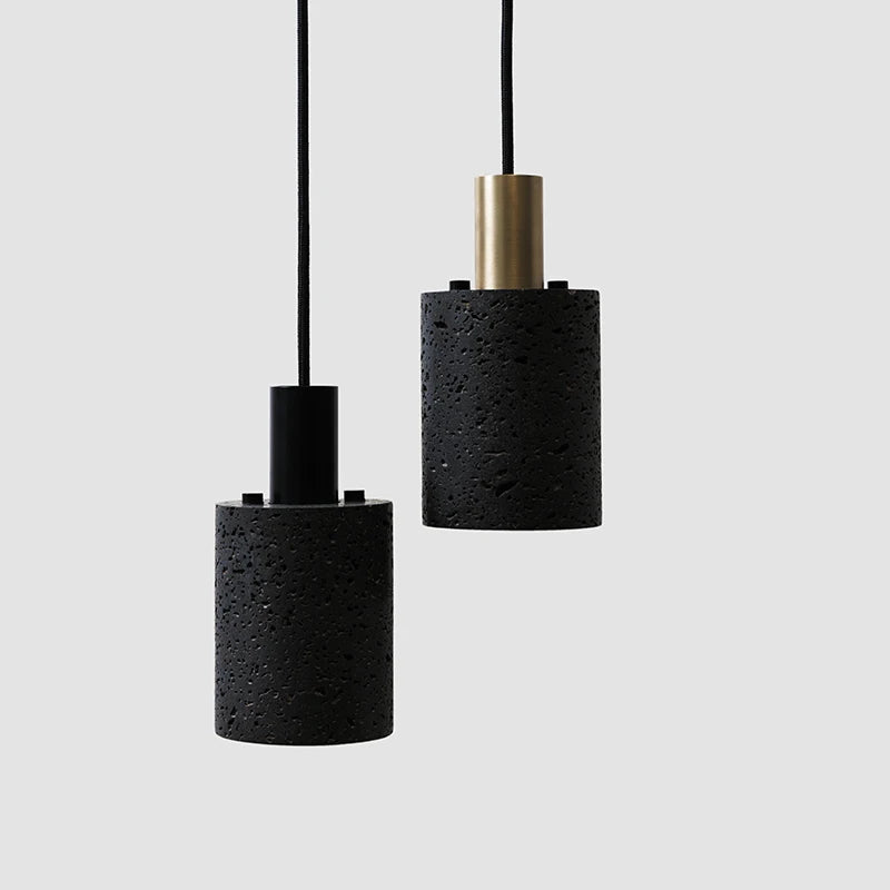 LUXELY black cement terrazzo pendant lights with cylindrical design and brass detail. Sleek industrial lighting for modern spaces.