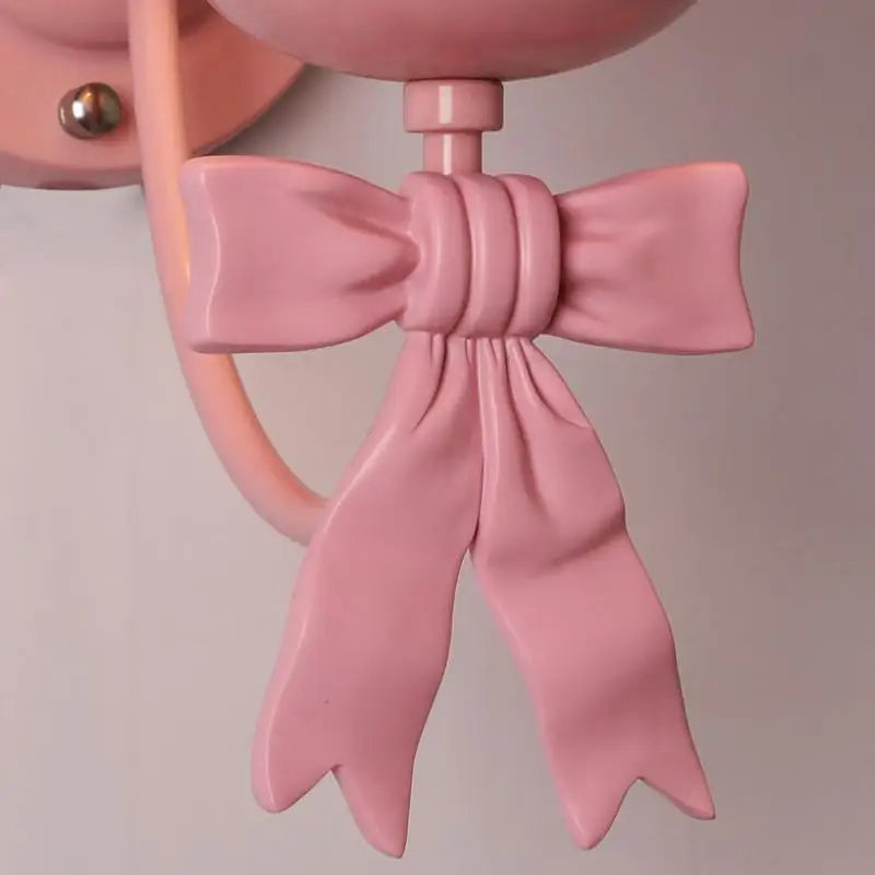 Close-up of pink bowknot detail on the Bowknot Princess Room Chandelier, showcasing elegant design for indoor wall-mounted lighting.