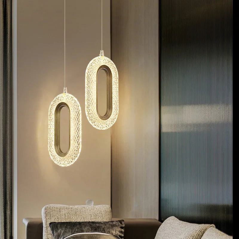 Contemporary living room with dual modern Nordic oval pendant lights, enhancing the space with stylish Scandinavian lighting.