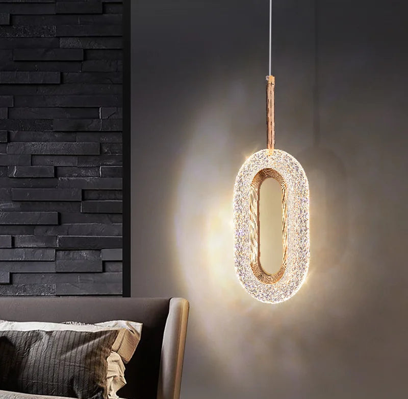 Single modern Nordic oval pendant light illuminating a bedroom with warm light, ideal for cozy and elegant decor.