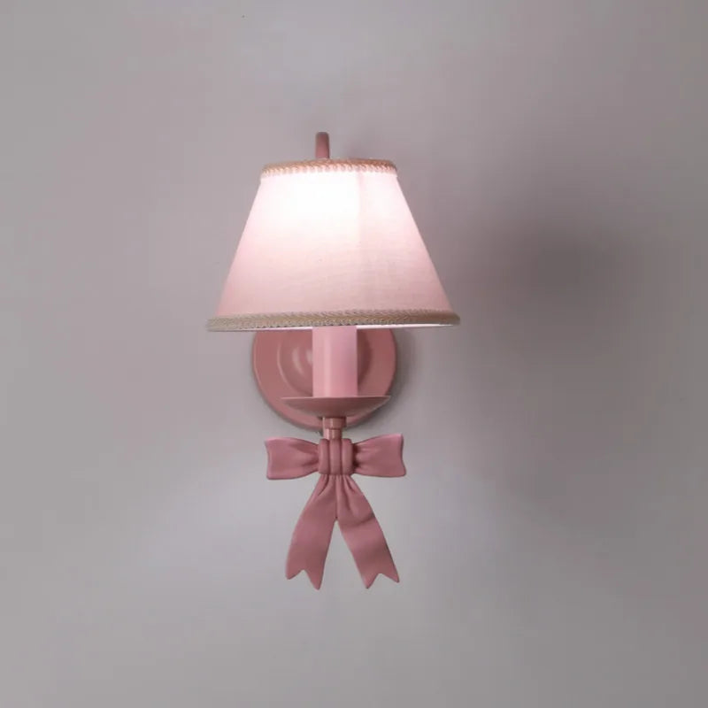 Single wall-mounted Bowknot Princess Room Chandelier with pink lampshade and decorative bow, ideal for bedroom or dining room lighting.