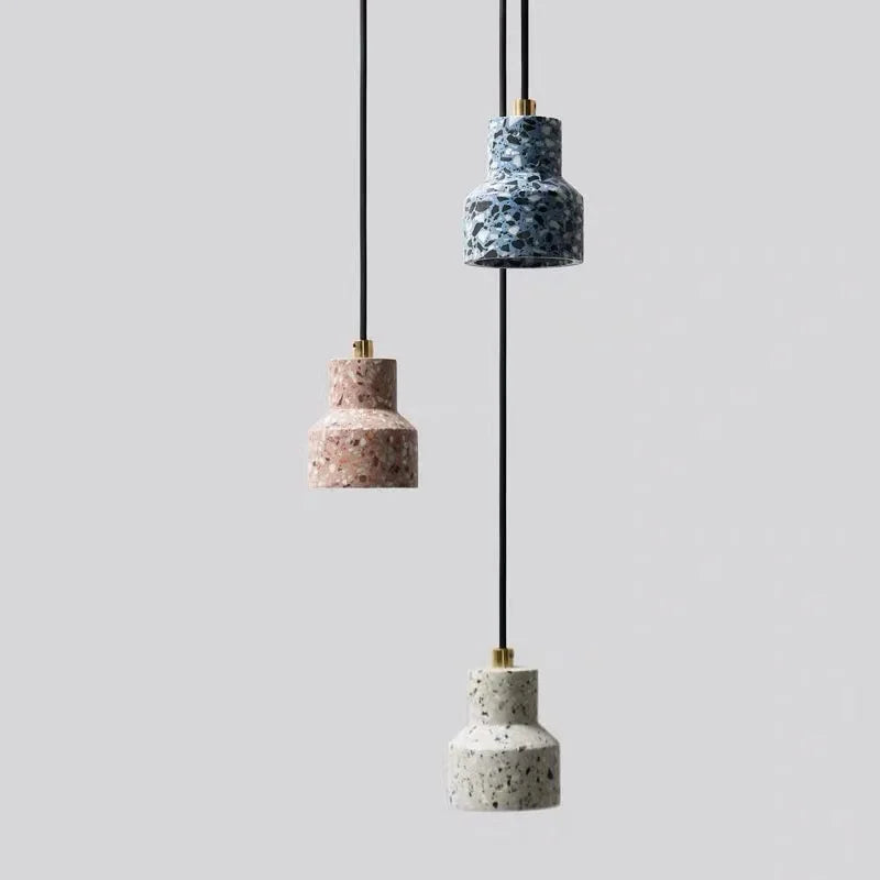 Vertical trio of LUXELY terrazzo pendant lights in pink, blue, and white cement, perfect for modern pendant bar lighting.