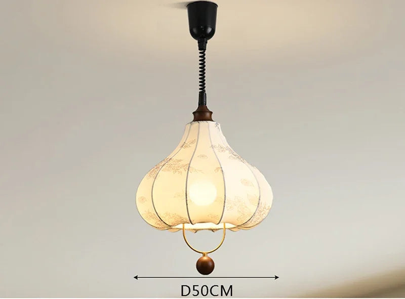 Modern Art Hanging Lamp with teardrop cloth shade and wood accent, a Nordic pendant light for stylish dining areas.