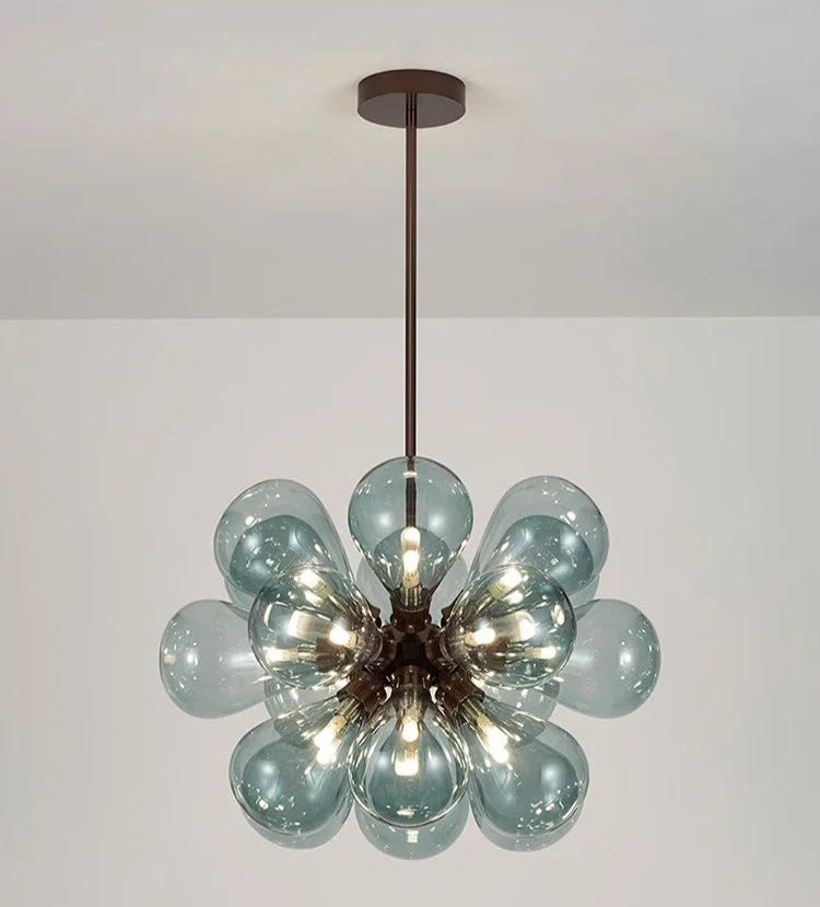 Scandinavian pendant light in blue glass with black lampbody, offering a bold and modern lighting solution.