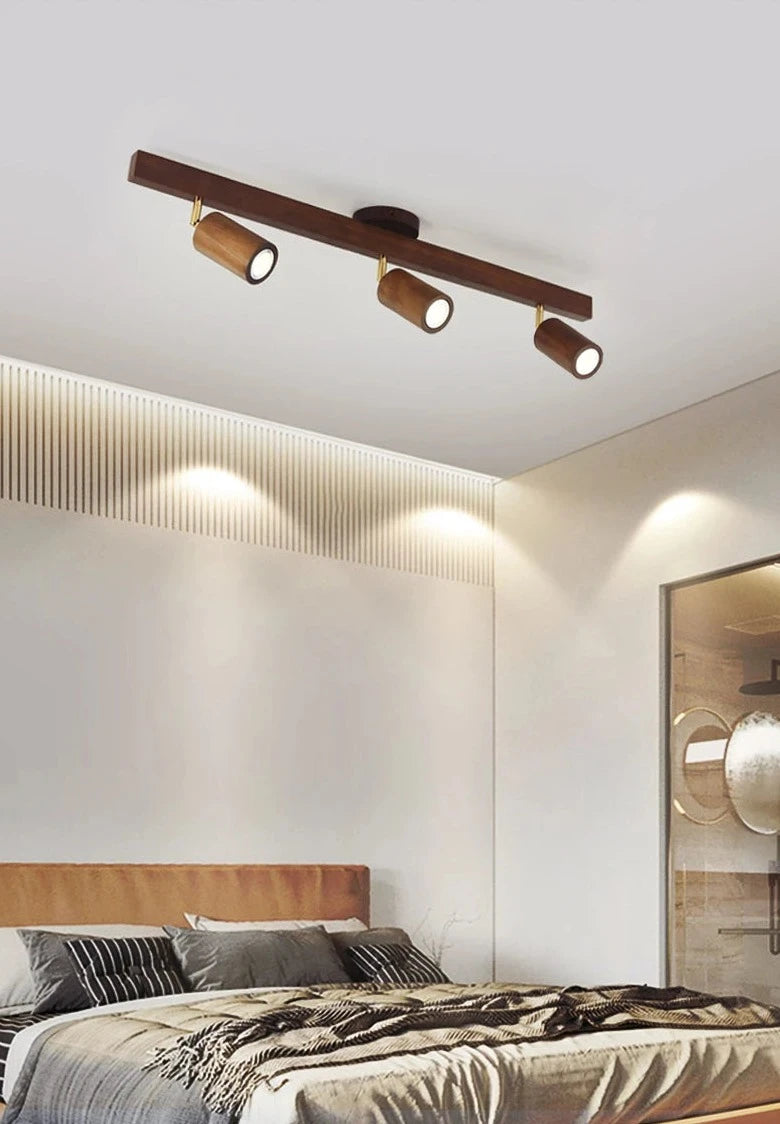 Scandinavian-style bedroom featuring LUXELY wood grain LED spotlight, perfect for warm and modern ceiling lighting ambiance.