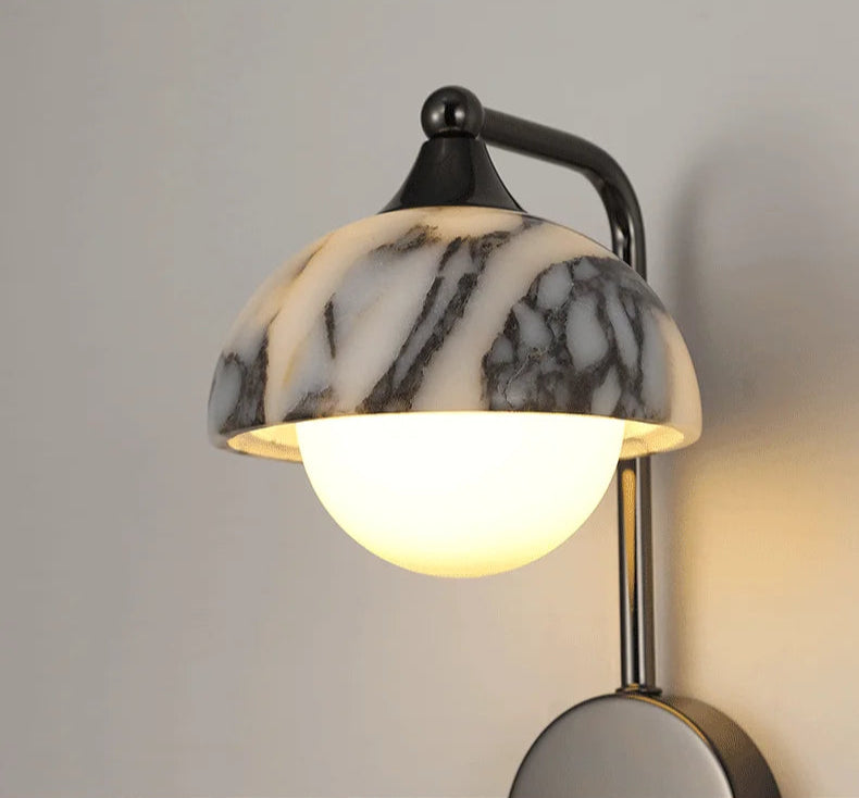 Product detail shots of alabaster wall sconce with black stone shade and metal base, emphasizing its modern and artistic features.