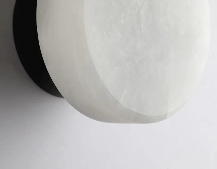 Close-up of white Spanish marble shade on Modern LED Wall Lamp, emphasizing its natural stone texture and quality.