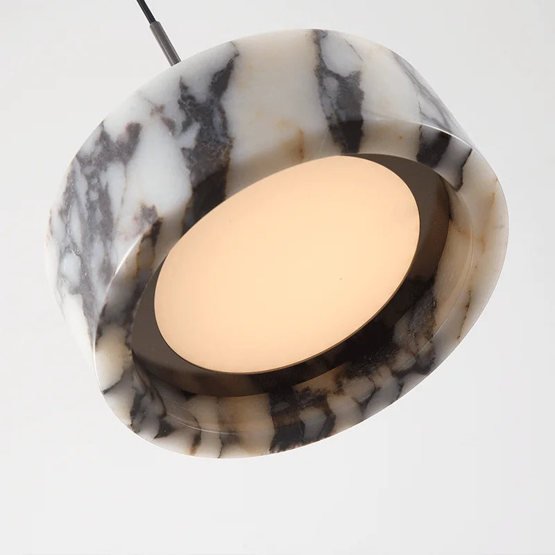 Close-up of Black Marble Dome Pendant - LED Lamp showing the illuminated underside and smooth marble texture for premium lighting appeal.