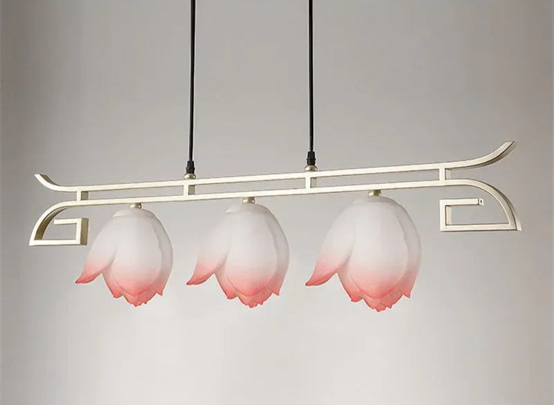 Modern lotus flower LED pendant light with three pink floral shades on a linear gold frame, perfect for vintage dining decor.