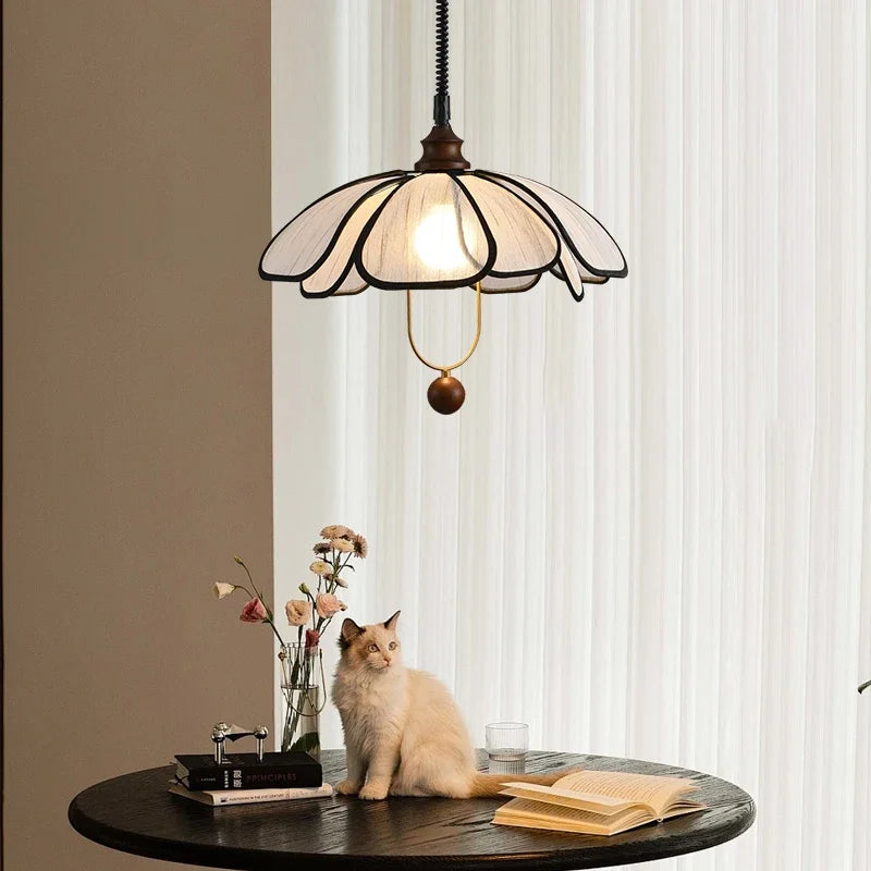 Modern Art Hanging Lamp with black petal frame and cloth shade, a Nordic pendant light perfect for reading nooks or dining.