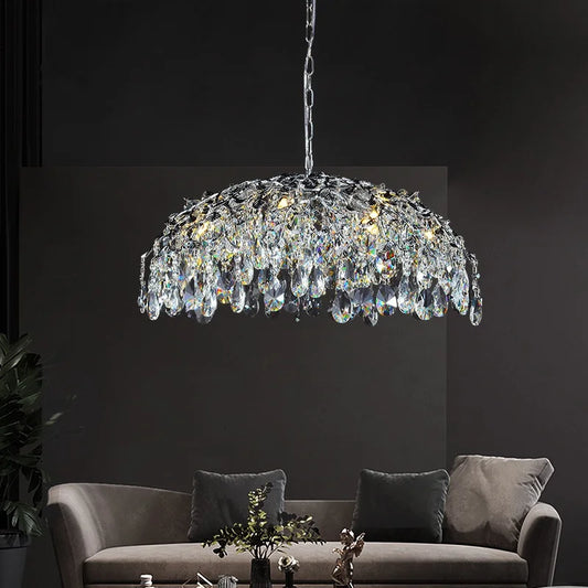 Italian crystal pendant light in chrome finish hanging above a modern grey sofa, ideal for kitchen or living room lighting decor.