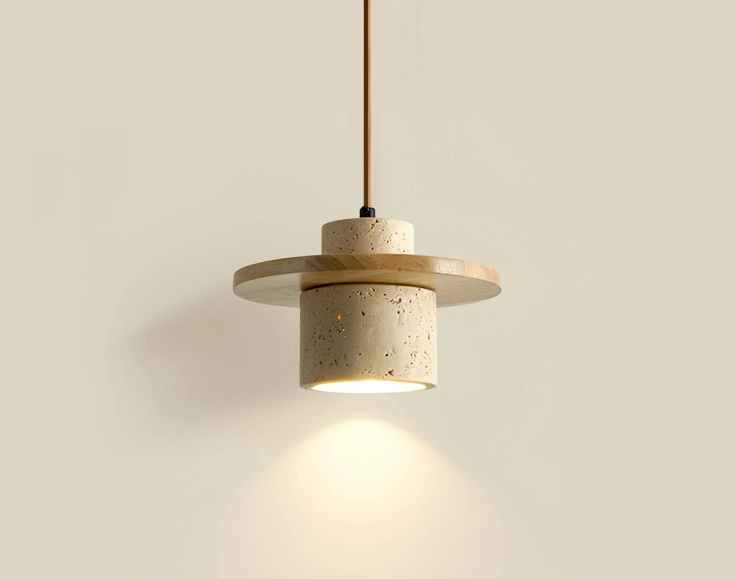 Minimalist travertine pendant light by LUXELY casting warm glow, perfect for Japanese-inspired home decor and bedroom lighting.