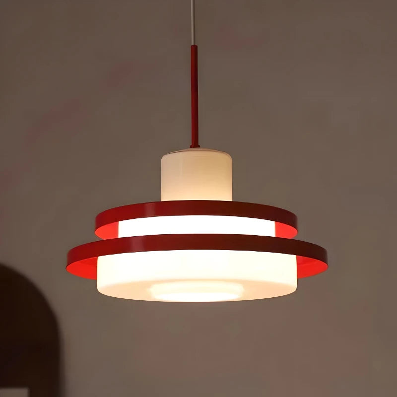 Modern vintage light fixture illuminated in a dim room, highlighting the warm glow of the Nordic Retro LED Chandelier.