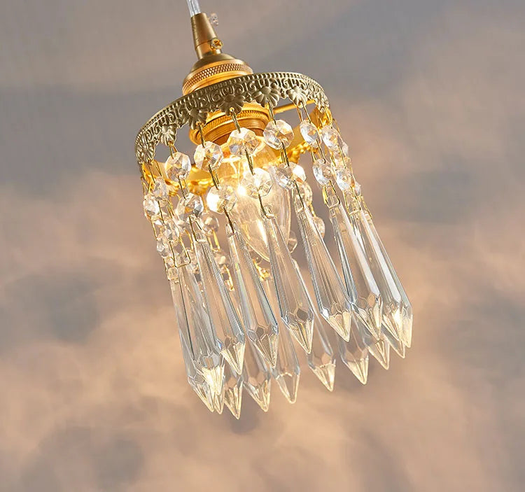 Underside of copper angel chandelier pendant light with clear crystal drops and gold frame, perfect for hallways.