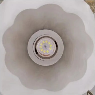 Interior view of Korean rose ceiling light showing LED bulb placement within scalloped frosted glass shade.