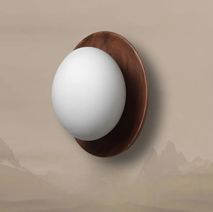 LUXELY walnut wood and brass wall sconce with soft white globe, perfect for hallway or bedroom accent lighting.