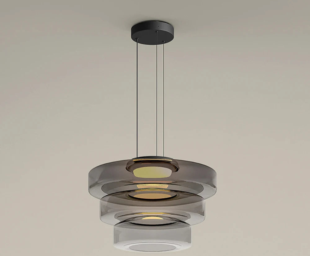 Smoke grey three-tier glass pendant light with LED. Elegant and modern, perfect for upscale kitchen or dining room lighting.