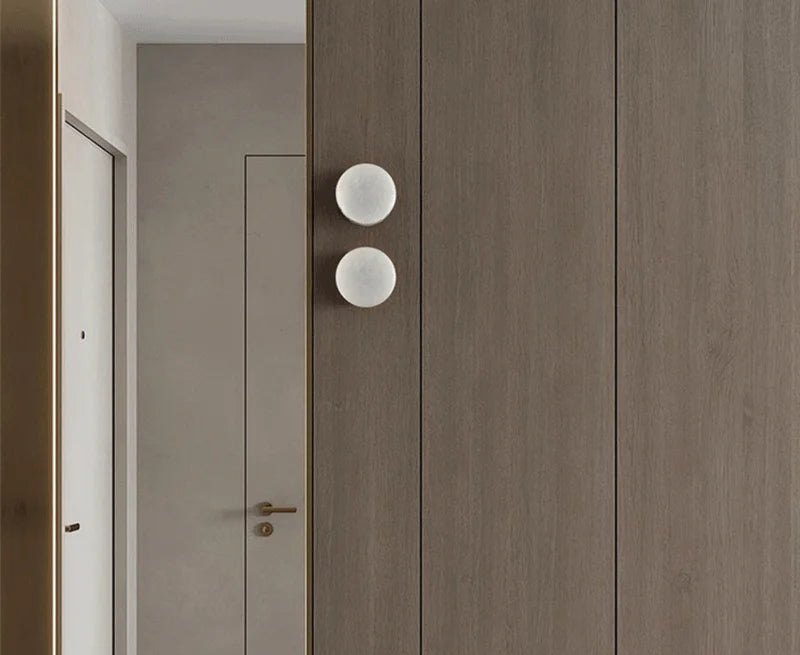 Modern LED Marble Wall Lamps installed in a wooden-paneled corridor, enhancing the space with warm, stylish lighting.