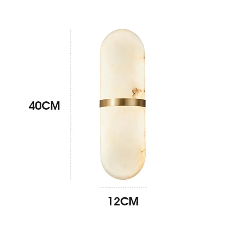 Dimensions of LUXELY oval marble wall lamp shown as 40cm height and 12cm width, featuring gold brass accent.