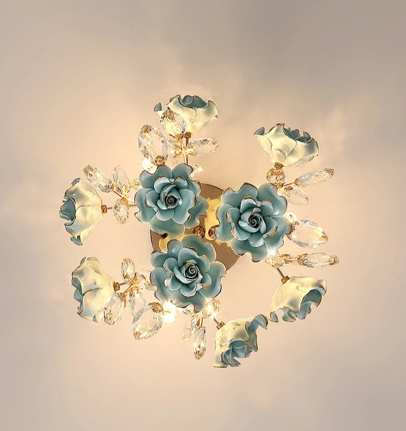 Top view of blue kids rose crystal chandelier featuring ceramic roses and crystal leaves for a whimsical ceiling light design.