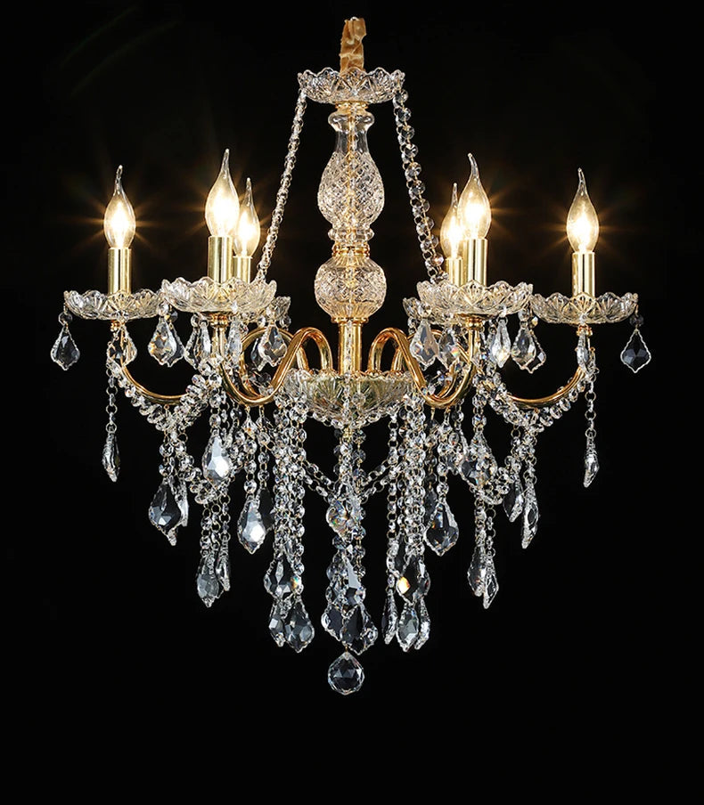 Five-light golden crystal chandelier with teardrop crystals and LED bulbs, ideal for upscale home décor.