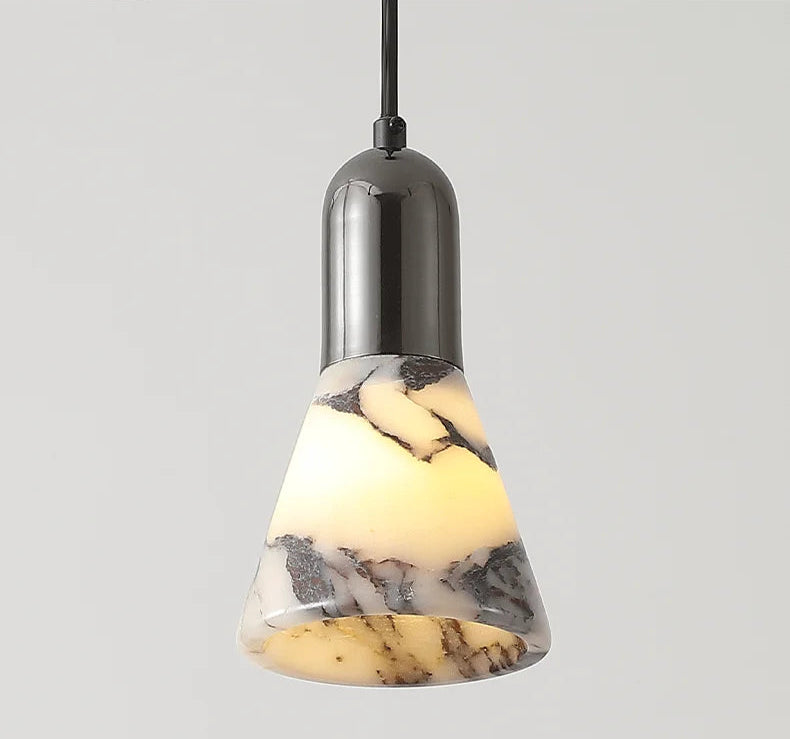 Dark Marble LED Pendant - Modern Ceiling Light turned on, emitting a soft warm glow through its marble-patterned conical shade.