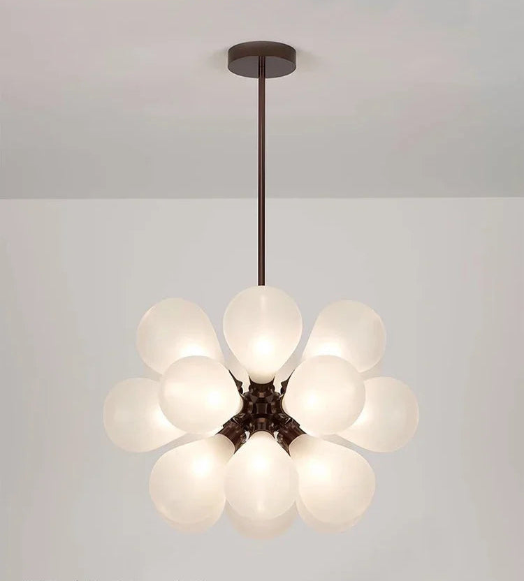 White Scandinavian chandelier with black lampbody, featuring frosted glass bubbles for a soft, elegant lighting effect.