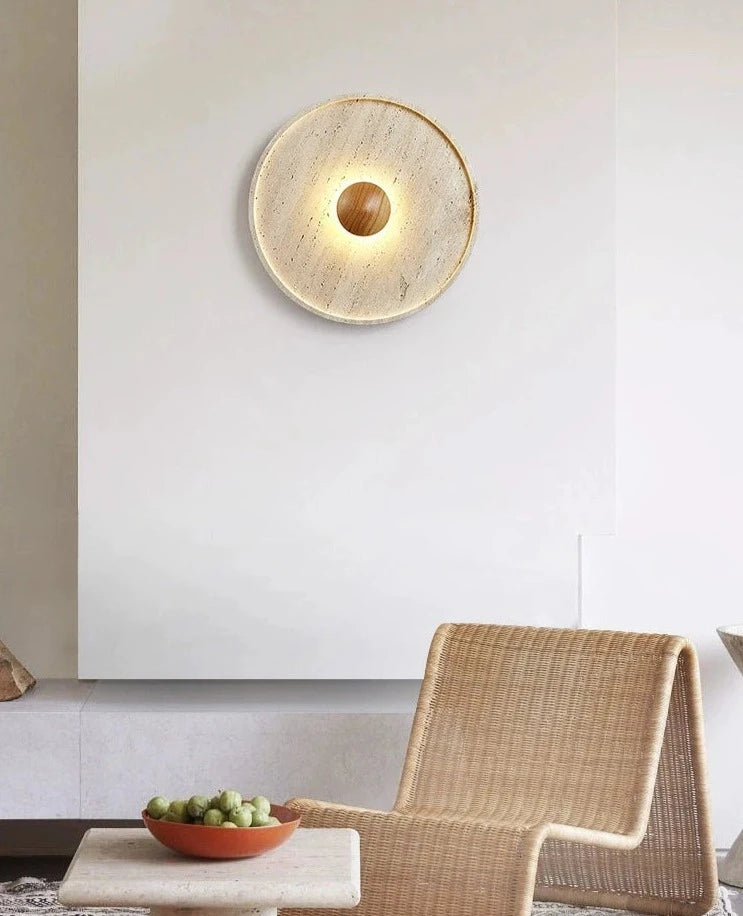 LUXELY Japanese wall sconce in travertine stone mounted in a modern living room, perfect for bedroom or dining wall lighting.