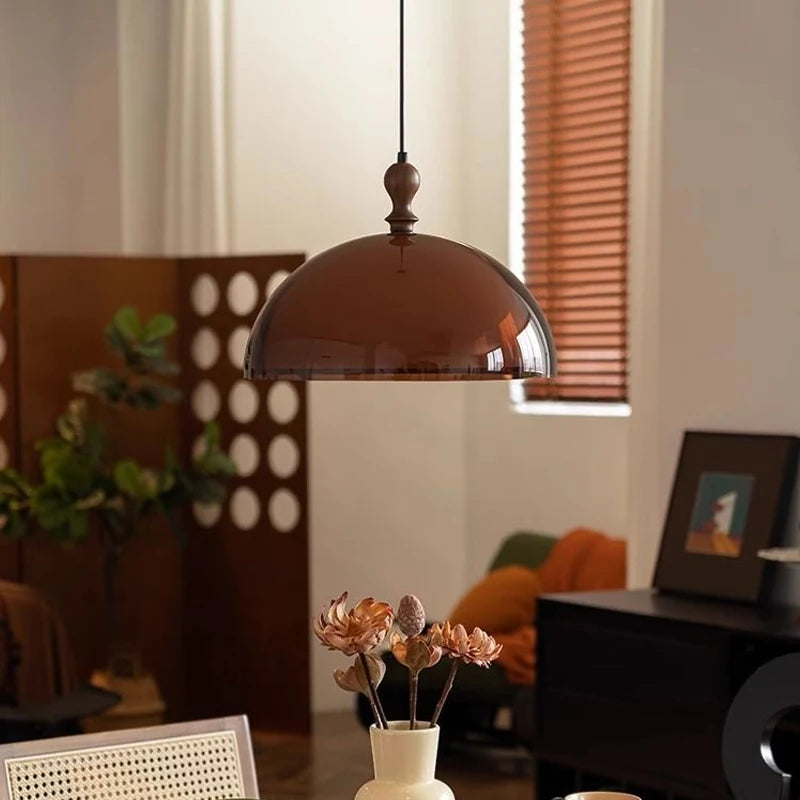 Dark amber version of the Modern LED Pendant Light, suspended in a contemporary dining room setting.