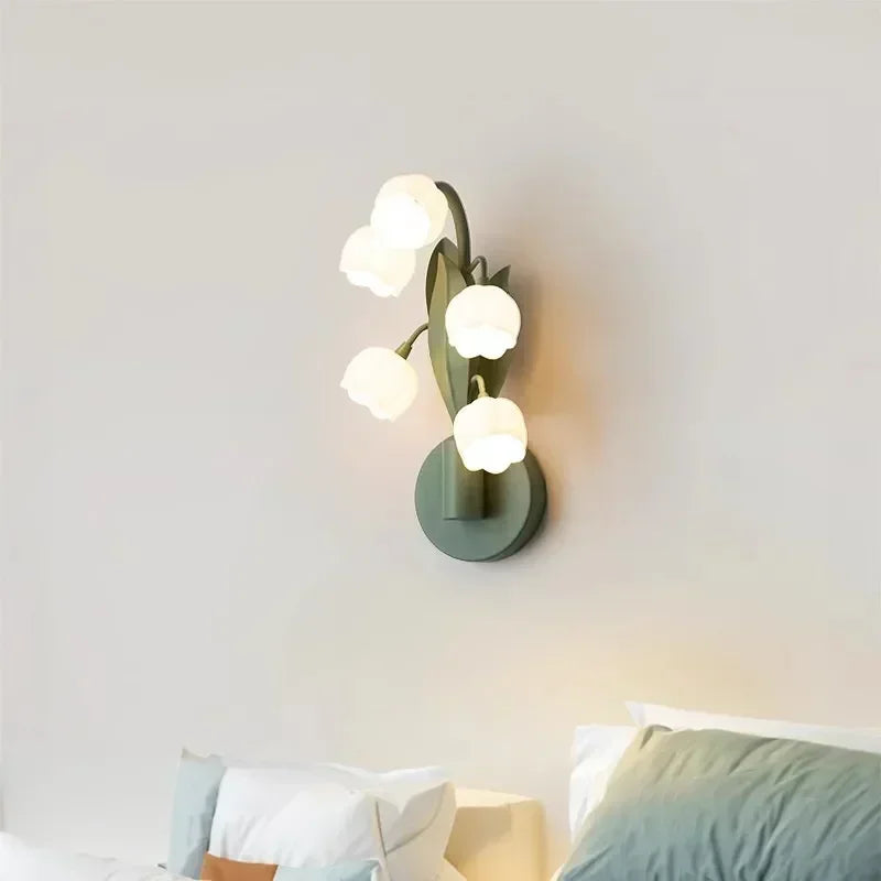 Nordic Atmosphere Wall Lamp installed above a bed, featuring tulip-style LED lights for cozy bedroom ambiance and modern floral decor.