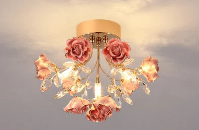 Pink kids rose crystal chandelier with soft lighting and floral design, perfect for a dreamy children's bedroom ceiling light.