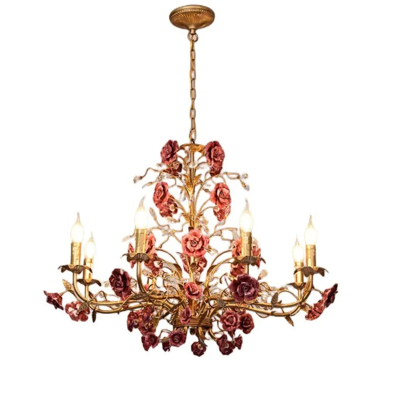 Elegant French ceiling light with deep rose ceramic flowers and gold finish, a vintage chandelier for restaurants or designer spaces.