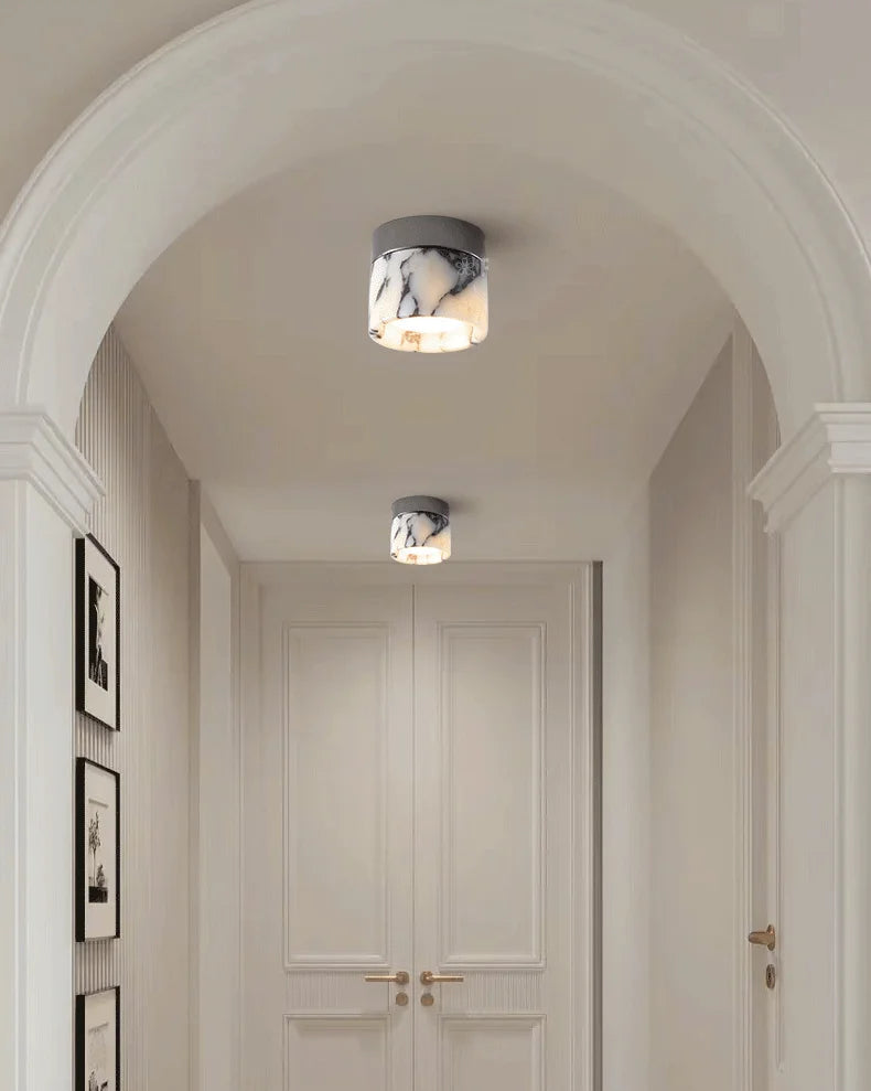 Stylish hallway with two Nordic LED wall sconces, combining marble glass and modern lighting for a warm, elegant ambiance.