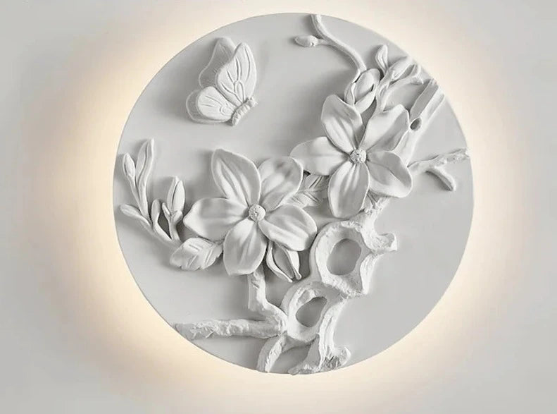 Round vintage sconce with butterfly and floral sculpture, dimmable LED light ideal for romantic wall lighting in bedrooms or restaurants.