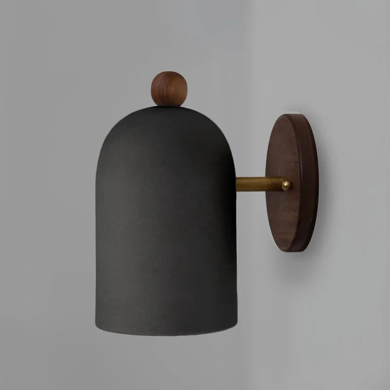 Black dome version of LUXELY walnut wood sconce with brass arm, ideal for modern and Nordic-style wall lighting.