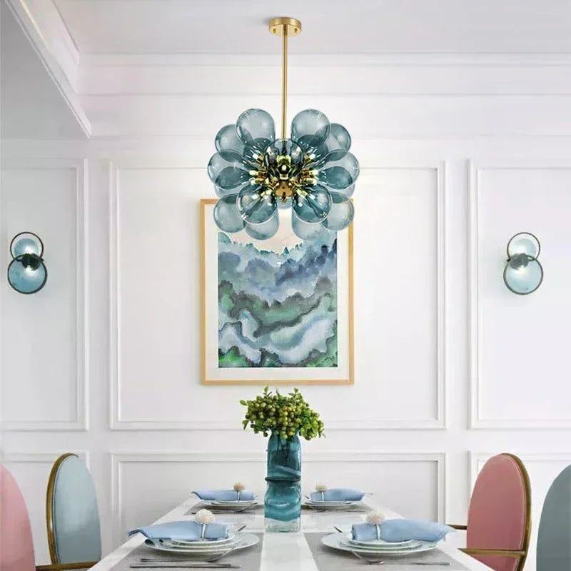 Nordic design pendant light with blue glass bubbles hanging over a dining table, enhancing elegant Scandinavian interior decor.