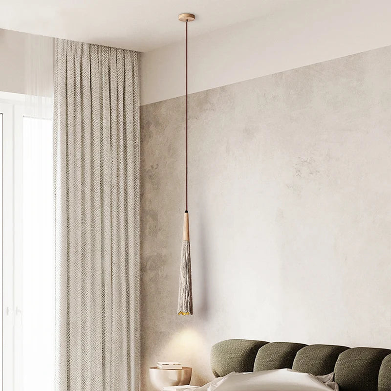 LUXELY travertine pendant lamp in bedroom corner, suspended from ceiling for soft ambient lighting and minimalist decor.