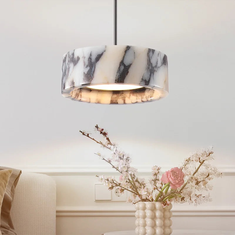 Black Marble Dome Pendant - LED Lamp adds elegance to a living room with its soft glow and high-end marble finish, perfect for luxury decor.