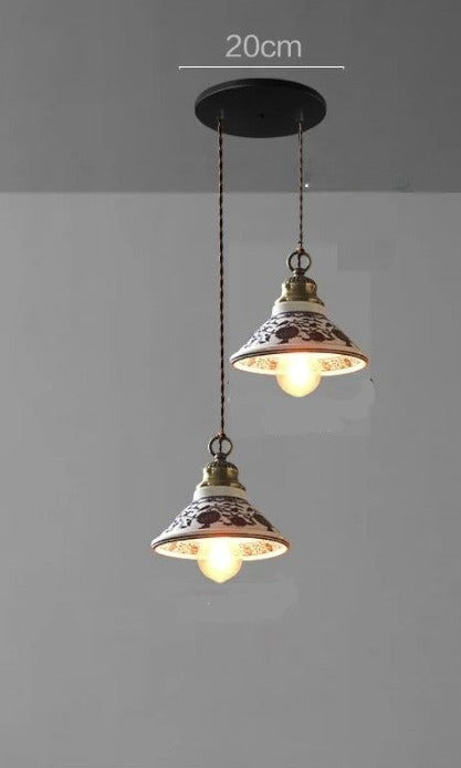 Two cone-shaped ceramic pendant lights with floral patterns on a 20cm ceiling base, ideal for farmhouse lighting.
