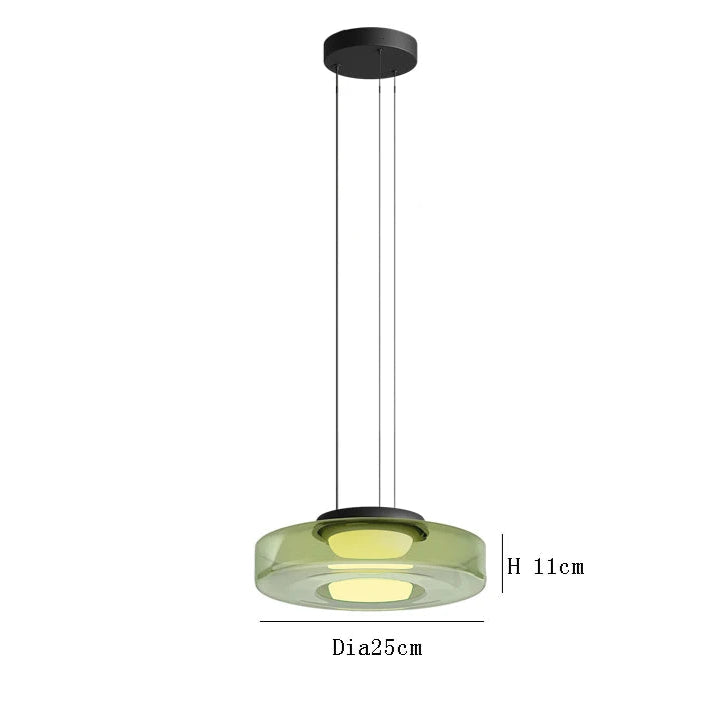 Green glass pendant light with 25cm diameter and 11cm height. LED source and adjustable wire for modern kitchen lighting.