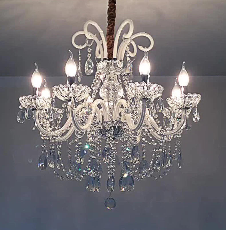 Nordic Crystal Chandelier - 8-Head Pendant Light glowing in a dim setting, showcasing its sparkling crystal design and elegant curves.