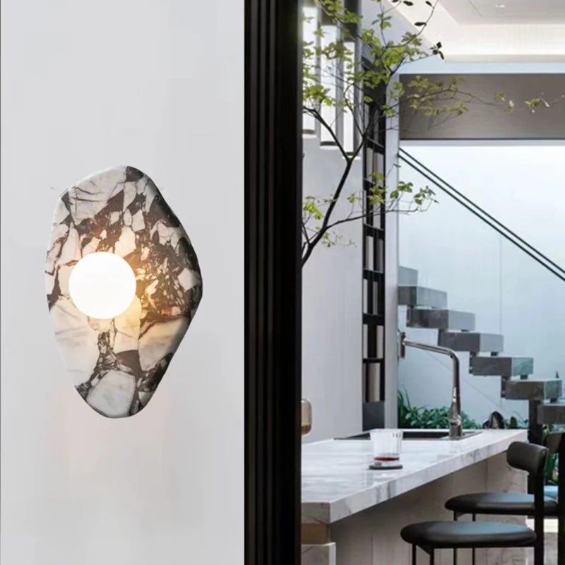 G9 Stone Wall Light with glass globe sconce installed in a modern kitchen hallway, blending natural stone with contemporary design.